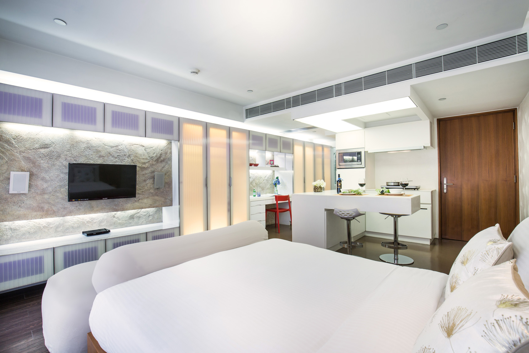 Premier Deluxe Suite with spacious bed at The V Wan Chai Serviced Apartment