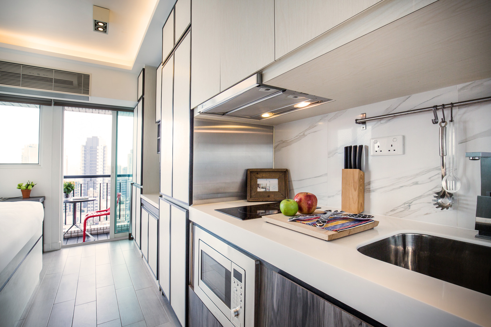 Studio kitchen with countertop space at The Lodge serviced apartment in West Kowloon