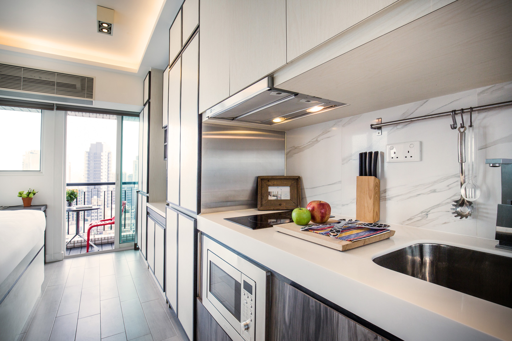 Studio kitchen with countertop space at The Lodge by V serviced apartment in West Kowloon