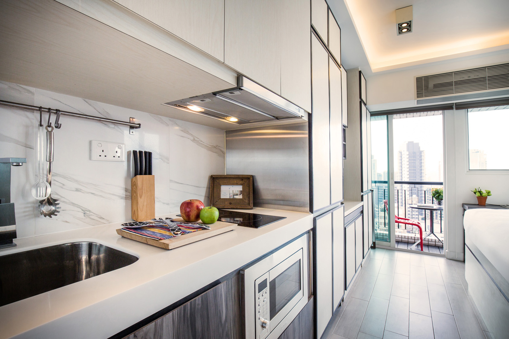 Studio kitchen with countertop space at The Lodge serviced apartment in West Kowloon